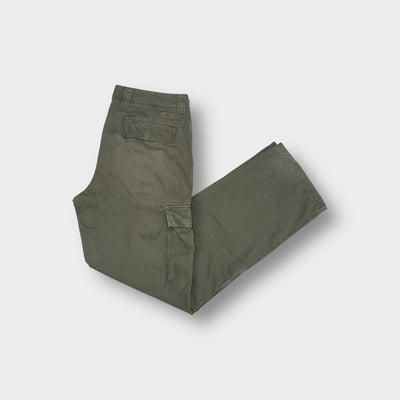Lacoste khaki cargo trousers with side flap pockets and a small logo patch.
