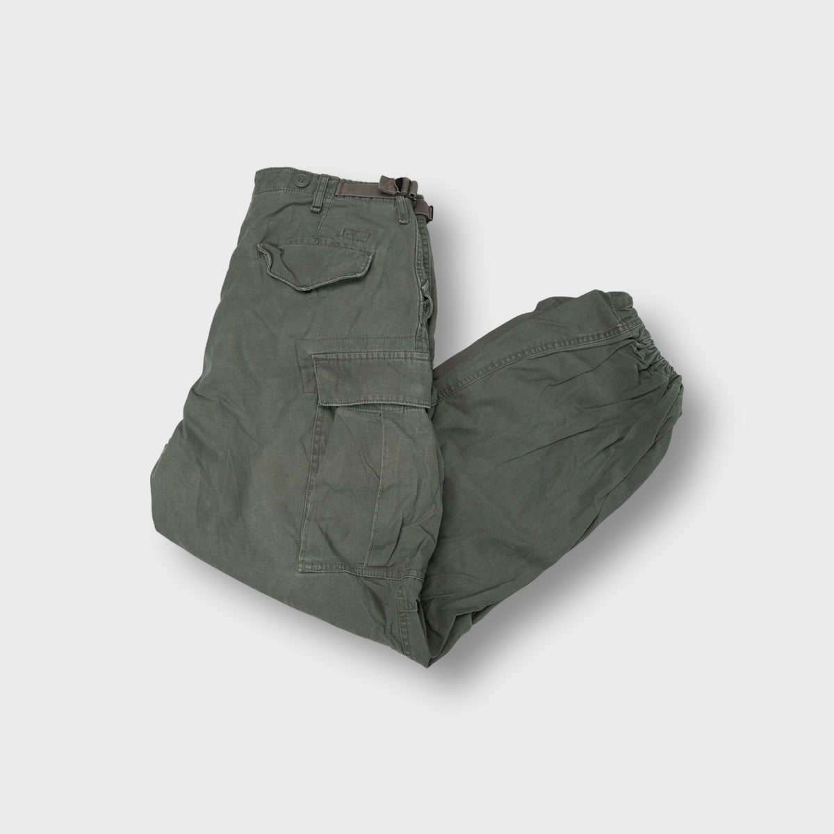 Vintage Fatigues khaki cargo pants with large utility flap pockets and cinch waist tabs