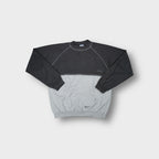 Grey Reebok sweater with contrasting paneling and front kangaroo pocket