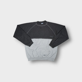 Grey Reebok sweater with contrasting paneling and front kangaroo pocket