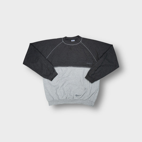 Grey Reebok sweater with contrasting paneling and front kangaroo pocket