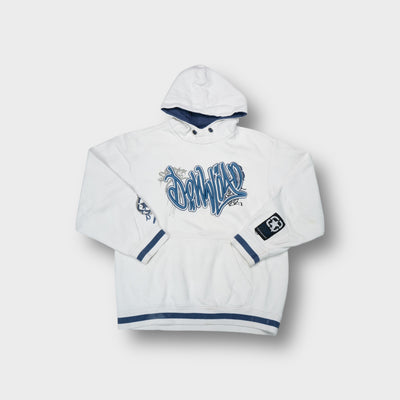 Here + There white hoodie featuring raised blue embroidered graffiti text across chest