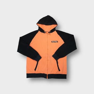 Harley Davidson sweatjacket in orange with black sleeves and an embroidered chest patch.