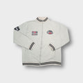 Beige full-zip sweater jacket with striped ribbed collar and racing patches.