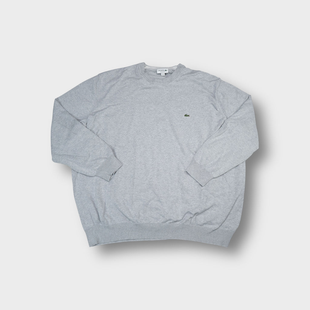 Grey Lacoste knit sweater featuring a small embroidered crocodile logo on the chest