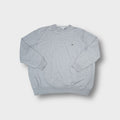 Grey Lacoste knit sweater featuring a small embroidered crocodile logo on the chest