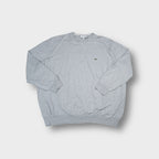 Grey Lacoste knit sweater featuring a small embroidered crocodile logo on the chest