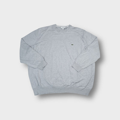 Grey Lacoste knit sweater featuring a small embroidered crocodile logo on the chest