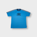 Umbro shirt in blue featuring printed shoulder tape and dark central chest logo