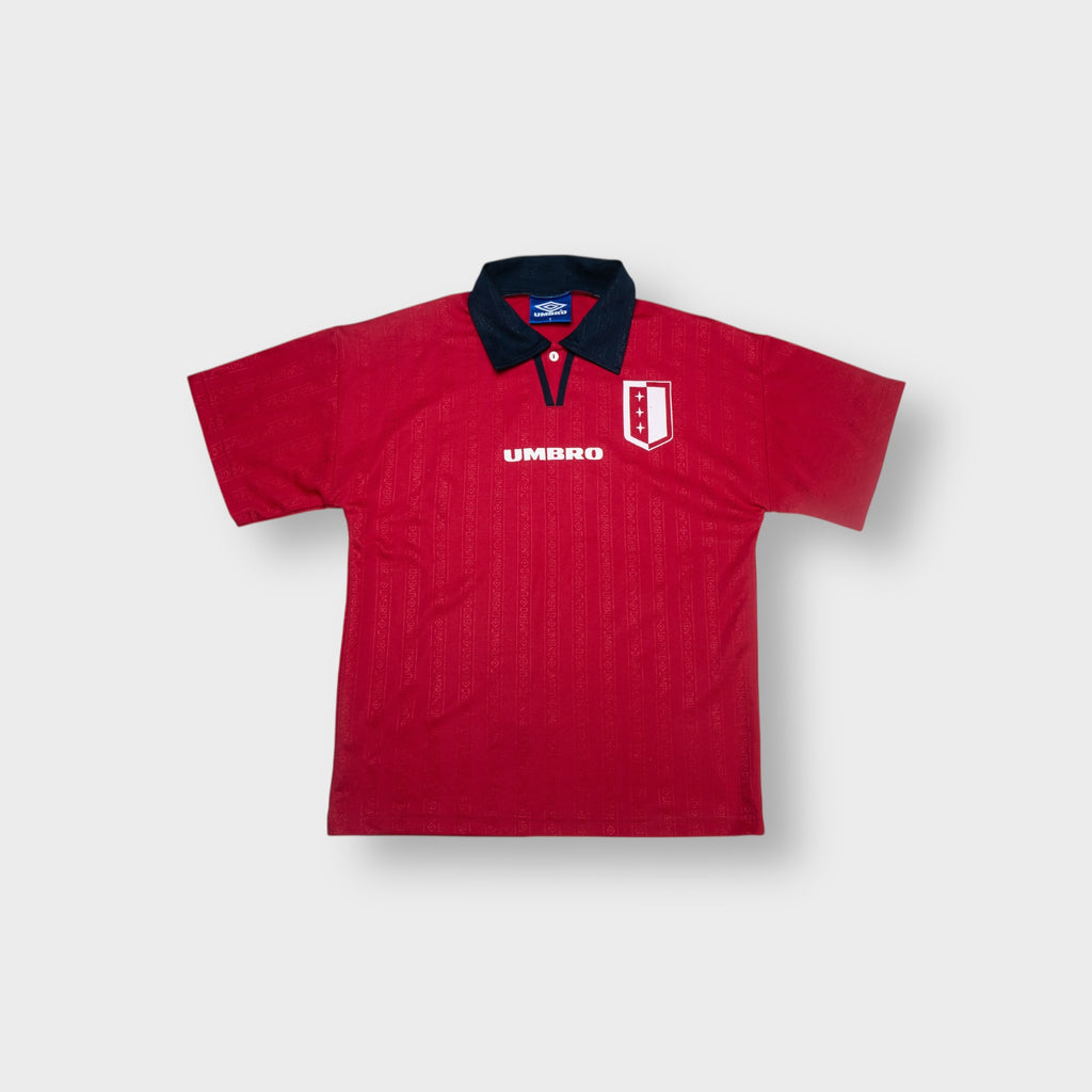 Umbro football jersey in red with a navy collar and crest on the chest