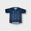 Adidas blue Newcastle United football shirt featuring an embroidered club crest and V-neck collar