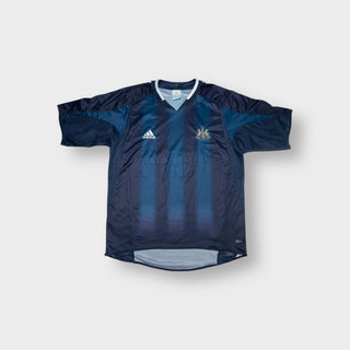 Adidas blue Newcastle United football shirt featuring an embroidered club crest and V-neck collar