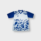 Killtec jersey shirt in white and blue featuring abstract geometric print and V-neck