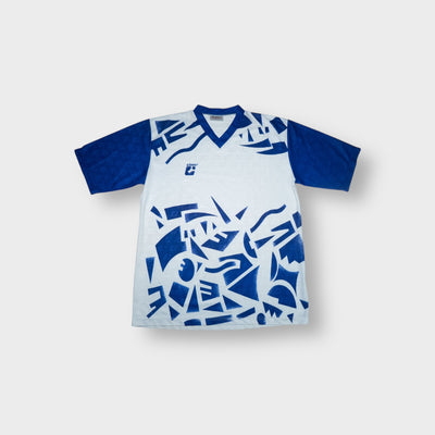 Killtec jersey shirt in white and blue featuring abstract geometric print and V-neck