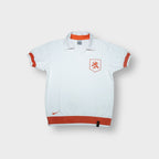 Nike Netherlands polo shirt in white featuring an orange KNVB lion crest