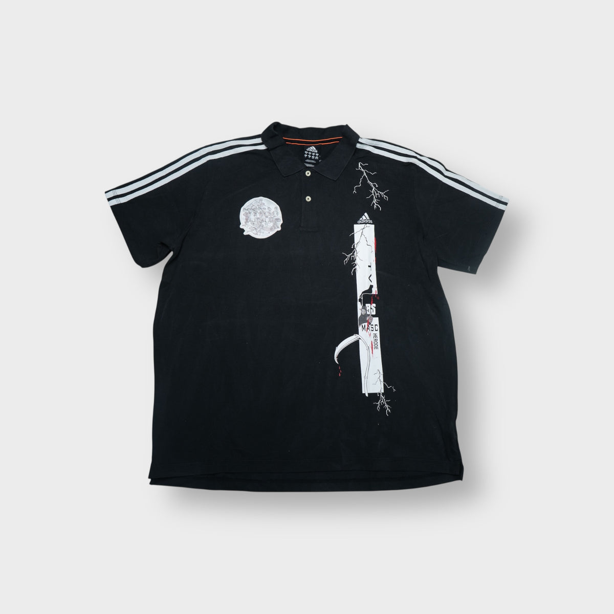 Black Adidas polo shirt with white three-stripes and custom graphic prints