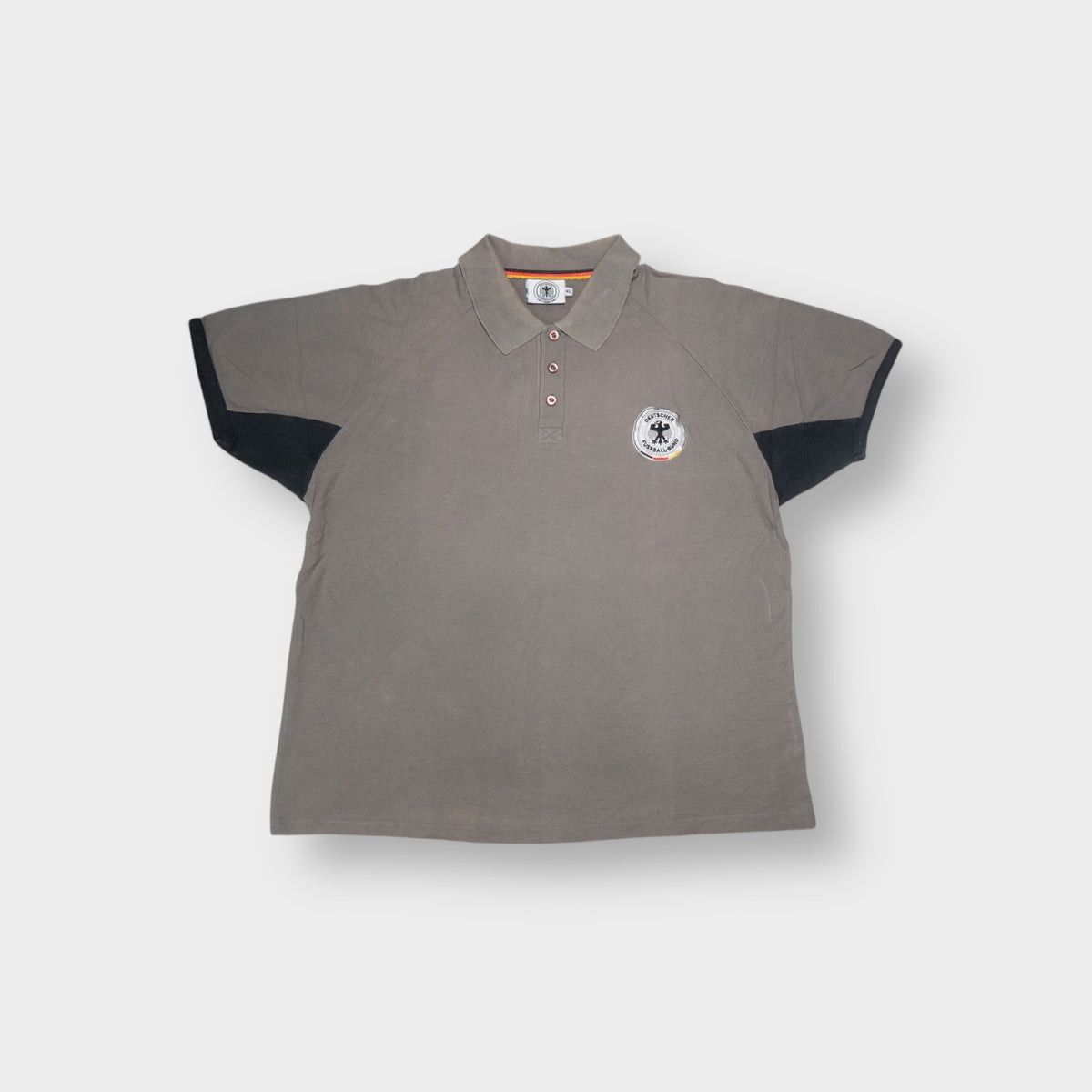 DFB khaki polo shirt featuring a black embroidered German football crest on the chest