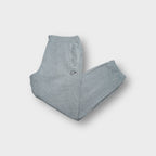 Nike grey sweatpants with small chest patch logo and drawstring waist