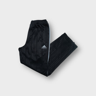Black Adidas Japan football track pants featuring the embroidered JFA emblem and logo.