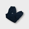 Adidas trackpants in navy blue with embroidered logo and lower leg stripe patch