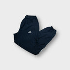 Adidas trackpants in navy blue with embroidered logo and lower leg stripe patch