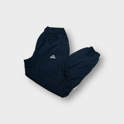 Adidas trackpants in navy blue with embroidered logo and lower leg stripe patch