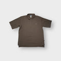 Adidas polo shirt in brown featuring a subtle embroidered chest logo and button placket