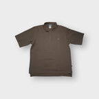 Adidas polo shirt in brown featuring a subtle embroidered chest logo and button placket