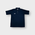 Umbro polo shirt in navy blue with an embroidered white chest logo.