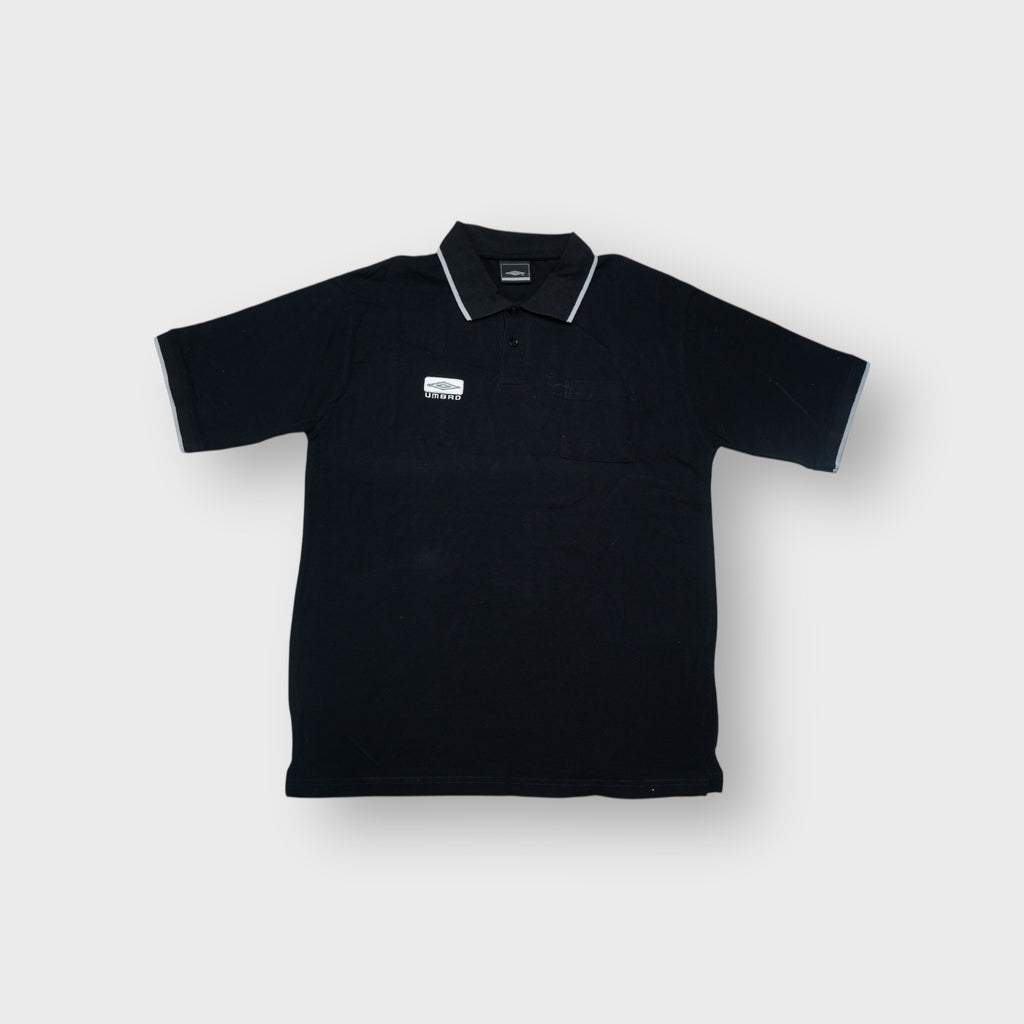 Umbro polo shirt in black featuring an embroidered chest logo patch and grey tipped collar