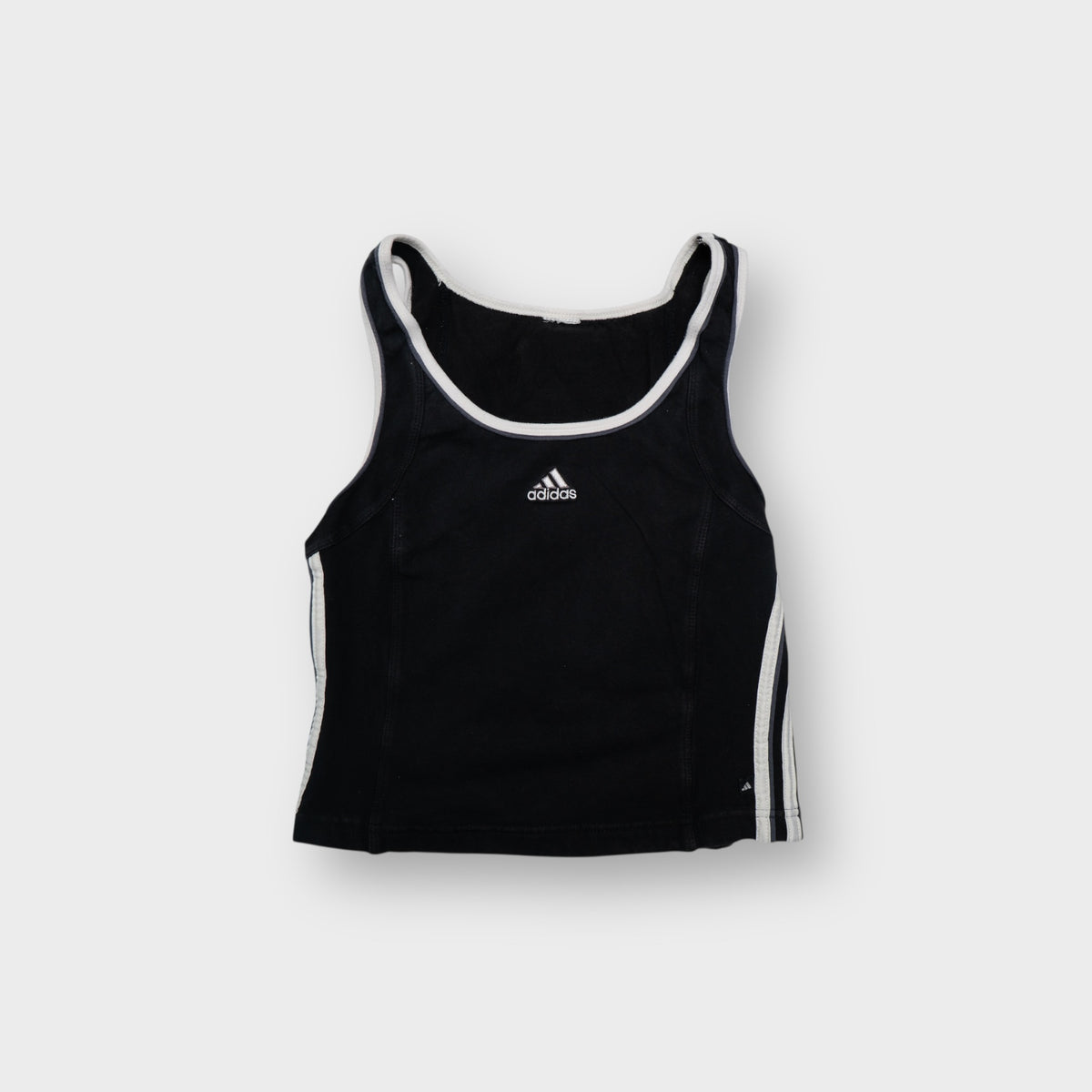 Adidas black tank top with white neck trim and embroidered center logo
