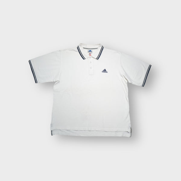 Adidas white polo shirt featuring striped collar trim and embroidered chest logo