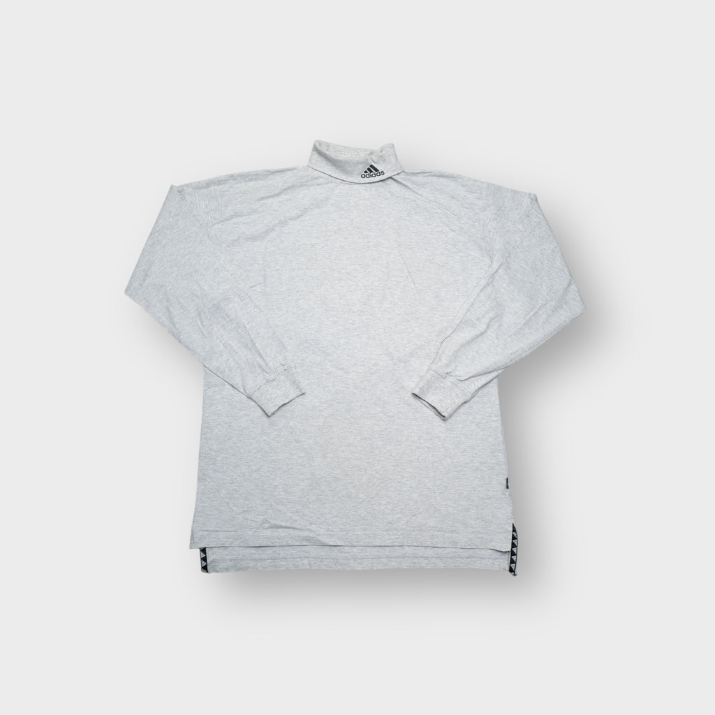 Grey Adidas turtleneck sweater featuring an embroidered equipment logo on the high collar.