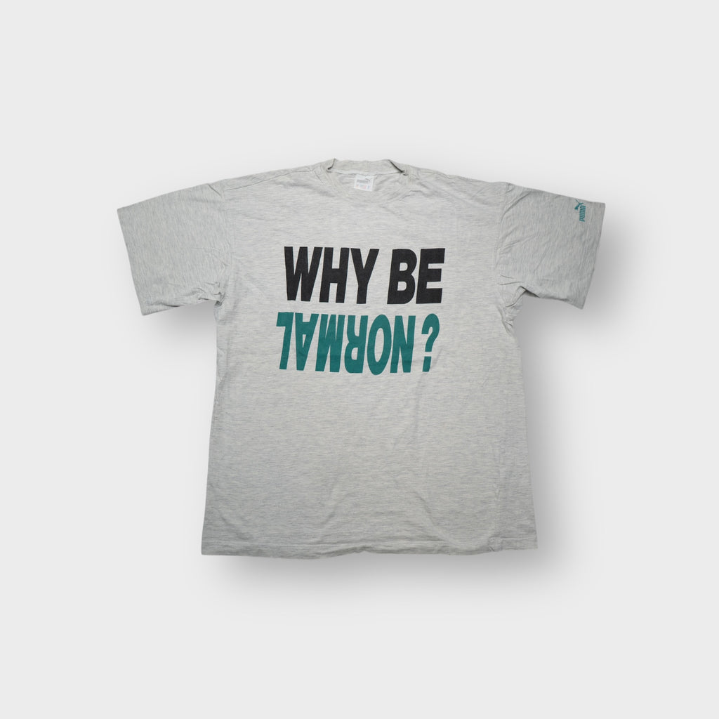 Grey Puma T-Shirt with a black and green inverted WHY BE NORMAL print on the chest