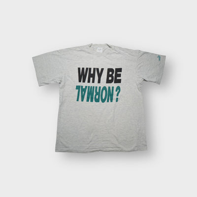 Grey Puma T-Shirt with a black and green inverted WHY BE NORMAL print on the chest