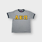 Champion grey ringer T-Shirt with yellow Alpha Epsilon Pi Greek applique letters.
