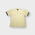 Umbro polo shirt in yellow with an embroidered chest logo and dark cuff trim