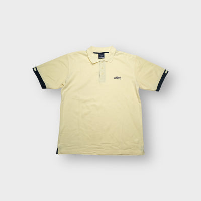 Umbro polo shirt in yellow with an embroidered chest logo and dark cuff trim