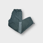 Grey Nike trackpants with contrast side panelling and adjustable toggle hem drawstrings