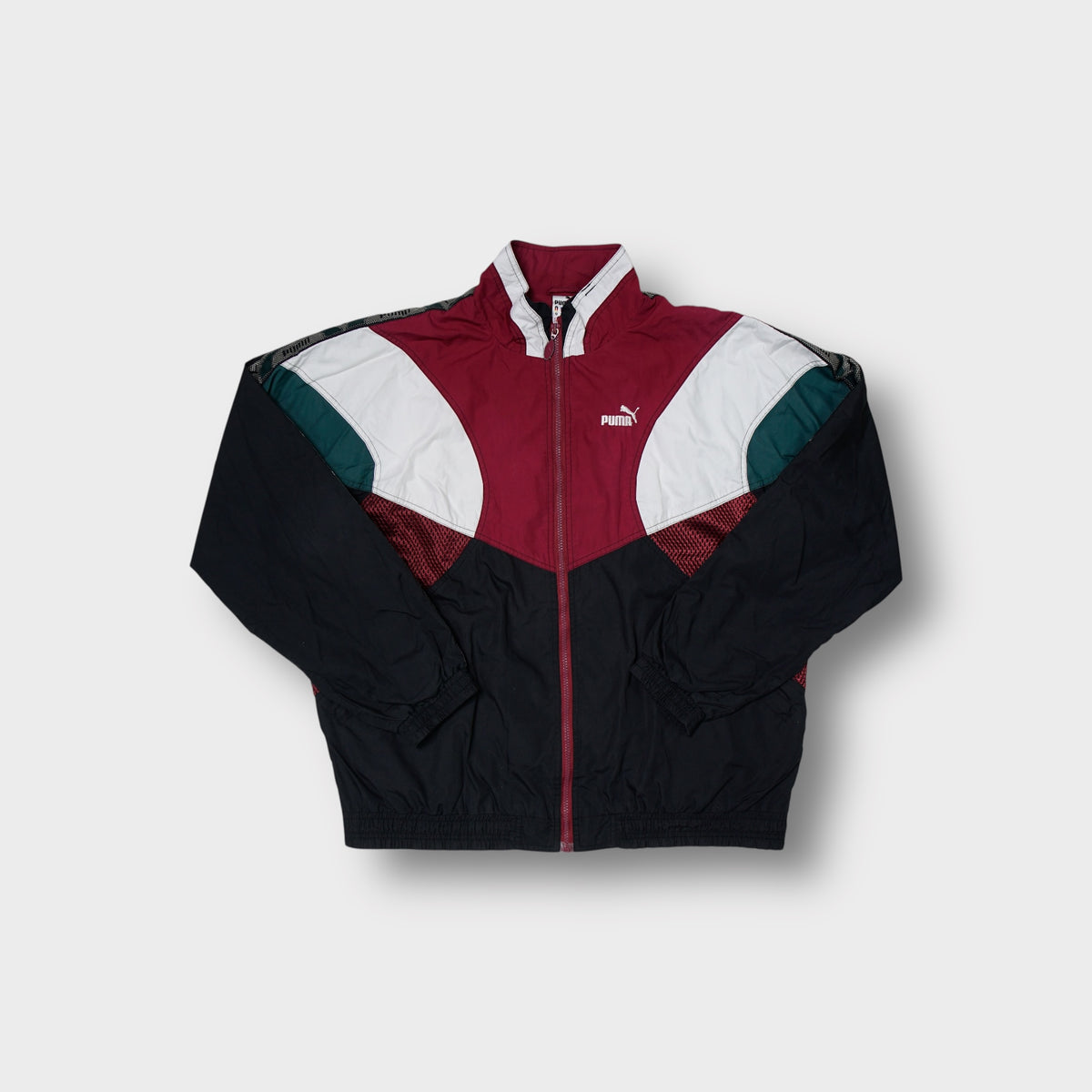 Black Puma track jacket with burgundy and white color-blocking and taped sleeves