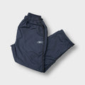 Reebok track pants in grey featuring an embroidered white Vector logo and side piping.