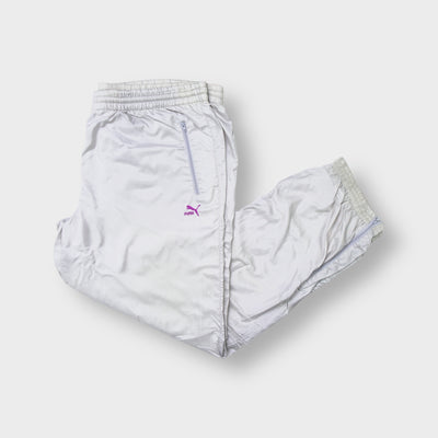 Puma trackpants in light grey with a purple embroidered logo and zipped pockets