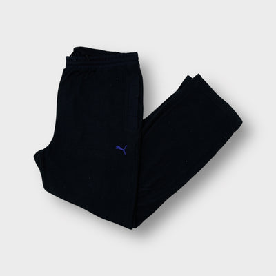 Puma fleece pants in black featuring a small purple embroidered logo on the thigh