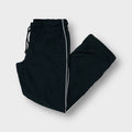 Nike black trackpants featuring white side piping and an elasticated waistband