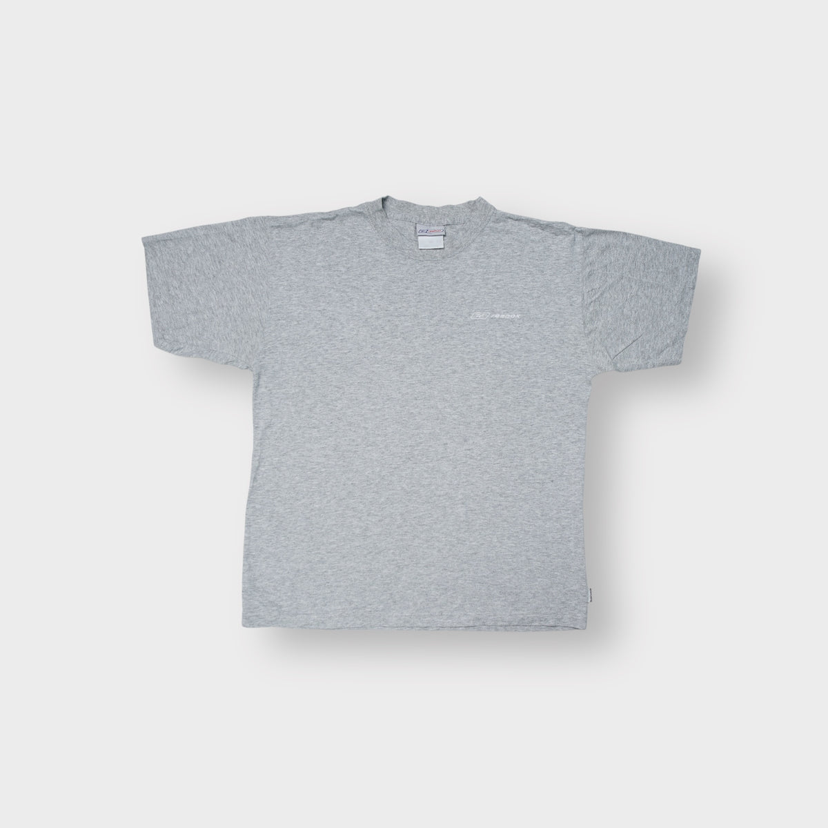Reebok short sleeve T-Shirt in grey with a small white embroidered logo on the chest