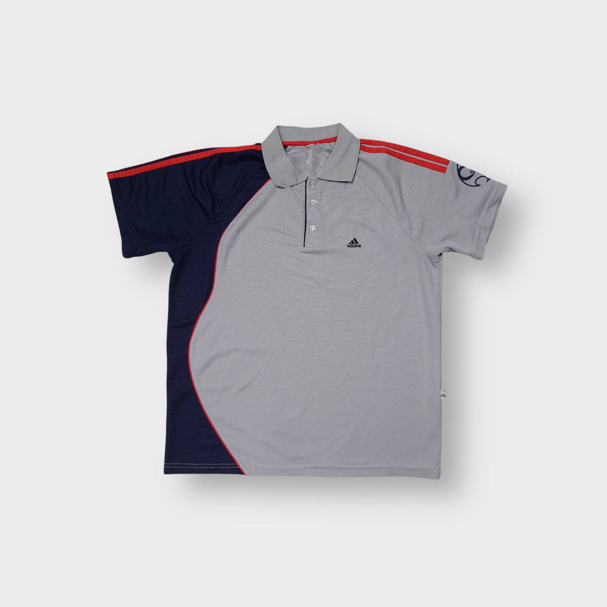 Adidas polo shirt in grey with red shoulder stripes and embroidered chest logo