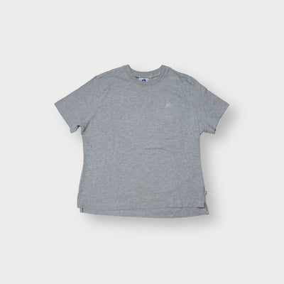 Adidas short-sleeve T-Shirt in grey with a small embroidered chest logo and side hem splits.