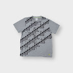 Grey Adidas T-Shirt featuring a black diagonal geometric diamond print across the front