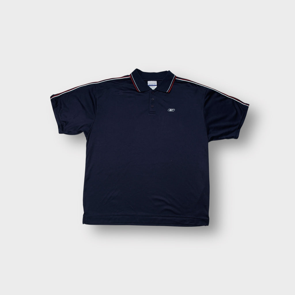 Reebok polo shirt in navy blue with red piping on collar and embroidered chest logo