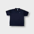 Reebok polo shirt in navy blue with red piping on collar and embroidered chest logo
